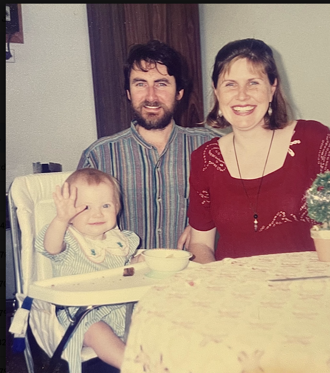 Mia as a baby with her parents on the Central Coast