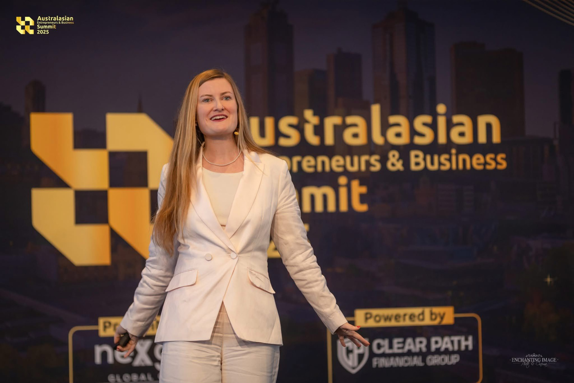 Mia speaking on stage at the Australasian Entrepreneurs & Business Summit